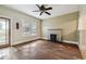 This living room features hardwood floors, a decorative fireplace, and an exterior door that provides natural light at 702 W Virginia Ave, Tampa, FL 33603