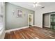 Bright living room features original hardwood floors and neutral paint colors at 702 W Virginia Ave, Tampa, FL 33603