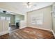 Spacious living room filled with natural light has craftsman details and fireplace at 702 W Virginia Ave, Tampa, FL 33603