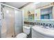 Bright bathroom featuring a step-in shower, vanity, and sink at 7053 El Conquistador St, Zephyrhills, FL 33541