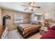 Bedroom featuring a bed, dresser, mirror, and carpeted floors at 7053 El Conquistador St, Zephyrhills, FL 33541