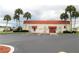 Community clubhouse with parking and nice landscaping in a beautiful community at 7053 El Conquistador St, Zephyrhills, FL 33541