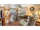 Inviting living room with hardwood floors, neutral decor, and abundant natural light at 7053 El Conquistador St, Zephyrhills, FL 33541