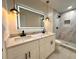 This bathroom boasts a double sink, and a glass shower at 733 Holly Ter, Brandon, FL 33511