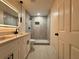 Modern bathroom featuring a dual sink vanity, illuminated mirror, and sleek, glass-enclosed shower with updated fixtures at 733 Holly Ter, Brandon, FL 33511