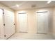 This bedroom features bright white doors, neutral walls, and light gray floors at 733 Holly Ter, Brandon, FL 33511