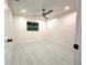 Cozy bedroom features modern ceiling fan, bright lighting, and white trim at 733 Holly Ter, Brandon, FL 33511