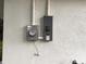 Home exterior featuring electrical panel and meters at 733 Holly Ter, Brandon, FL 33511
