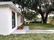 Home exterior featuring manicured lawn, mulch, and plants at 733 Holly Ter, Brandon, FL 33511