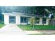Inviting single-story home with a well-manicured lawn and welcoming entrance at 733 Holly Ter, Brandon, FL 33511