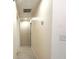Clean hallway features easy access to rooms, with neutral paint and updated flooring at 733 Holly Ter, Brandon, FL 33511