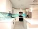 Modern kitchen with stainless steel appliances, stylish backsplash, and ample counter space at 733 Holly Ter, Brandon, FL 33511
