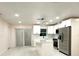 Modern kitchen features stainless steel appliances, white cabinets and an island at 733 Holly Ter, Brandon, FL 33511