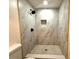 This bathroom features a step-in shower with unique tile work at 733 Holly Ter, Brandon, FL 33511