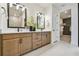 Modern bathroom with dual sinks, quartz countertops, and a walk-in closet at 755 Maldives Trl, Sarasota, FL 34234