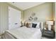 Comfortable bedroom with neutral tones, decorative wall art and large closet at 755 Maldives Trl, Sarasota, FL 34234