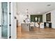 Bright, open kitchen with a center island, stainless steel appliances, and modern pendant lighting at 755 Maldives Trl, Sarasota, FL 34234