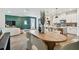 Open concept dining and living areas with white furniture and modern accents at 755 Maldives Trl, Sarasota, FL 34234