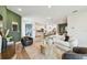 Open-concept design seamlessly connects the living room and kitchen, creating a spacious and inviting atmosphere at 755 Maldives Trl, Sarasota, FL 34234