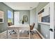 Bright office space with large window, neutral walls, and modern furnishings for a productive work environment at 755 Maldives Trl, Sarasota, FL 34234