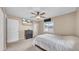Relaxing bedroom with ceiling fan, TV, and bright window for natural light and comfortable space at 812 Regent Circle S, Brandon, FL 33511