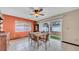 Bright dining room featuring a ceiling fan and sliding glass doors to the backyard at 812 Regent Circle S, Brandon, FL 33511