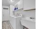 Efficient laundry room with washer, dryer, utility sink, and cabinet space for storage at 812 Regent Circle S, Brandon, FL 33511