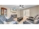 Cozy living room featuring a large television, tile floors, and comfortable seating at 812 Regent Circle S, Brandon, FL 33511