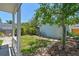 Serene backyard features a stone path, grassy area, privacy fence, and a detached garage at 834 26Th N Ave, St Petersburg, FL 33704