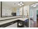 Bathroom with modern fixtures, classic black and white tiling, and a large framed mirror at 834 26Th N Ave, St Petersburg, FL 33704