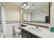 Bathroom features white tiled walls, black and white accent tiles, and a modern vanity with marble countertop at 834 26Th N Ave, St Petersburg, FL 33704