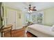 Light and airy bedroom with hardwood floors, neutral walls, and large windows at 834 26Th N Ave, St Petersburg, FL 33704