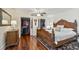 Spacious bedroom with elegant wooden bed, hardwood floors, and walk-in closets at 834 26Th N Ave, St Petersburg, FL 33704