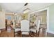 Light-filled dining room showcases beautiful hardwood floors, chandelier, and convenient access to the kitchen at 834 26Th N Ave, St Petersburg, FL 33704