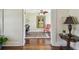 Bright home office with hardwood floors and vintage accents seen through an open doorway at 834 26Th N Ave, St Petersburg, FL 33704