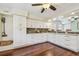 Spacious kitchen offering white cabinets, granite counters, dark hardwood floors, and ample storage at 834 26Th N Ave, St Petersburg, FL 33704