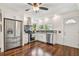 Modern kitchen featuring stainless steel appliances, granite counters, and white cabinets at 834 26Th N Ave, St Petersburg, FL 33704