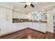 Spacious kitchen featuring white cabinets, granite countertops, and modern appliances at 834 26Th N Ave, St Petersburg, FL 33704
