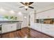 Full kitchen view featuring white cabinets, granite counters, stainless appliances, and dark wood floors at 834 26Th N Ave, St Petersburg, FL 33704