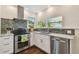 Close up on the kitchen with stainless steel appliances and granite countertops at 834 26Th N Ave, St Petersburg, FL 33704