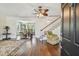 Open-concept living room with hardwood floors and a view into the dining room at 834 26Th N Ave, St Petersburg, FL 33704