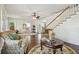 Spacious living room featuring hardwood floors, a staircase, and multiple doorways at 834 26Th N Ave, St Petersburg, FL 33704