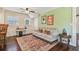 Charming living room featuring a comfortable sofa, area rug, and view to other spaces at 834 26Th N Ave, St Petersburg, FL 33704