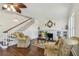 Cozy living room with a decorative fireplace, built-in bookshelves, and staircase at 834 26Th N Ave, St Petersburg, FL 33704