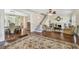 Bright living room featuring a decorative fireplace, hardwood floors, and stairway to the upper level at 834 26Th N Ave, St Petersburg, FL 33704