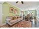 Comfortable living room with hardwood floors and neutral-colored sofa and dining room in background at 834 26Th N Ave, St Petersburg, FL 33704