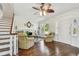 Bright living room with a fireplace, hardwood floors, and a large window at 834 26Th N Ave, St Petersburg, FL 33704