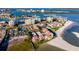 An aerial view highlighting the community's waterfront location near the beach and various community houses at 845 S Gulfview Blvd # 110, Clearwater Beach, FL 33767