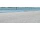 Expansive view of a pristine sandy beach and tranquil waters at 845 S Gulfview Blvd # 110, Clearwater Beach, FL 33767
