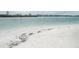 Sandy beach with calm waters, perfect for a relaxing day by the water at 845 S Gulfview Blvd # 110, Clearwater Beach, FL 33767
